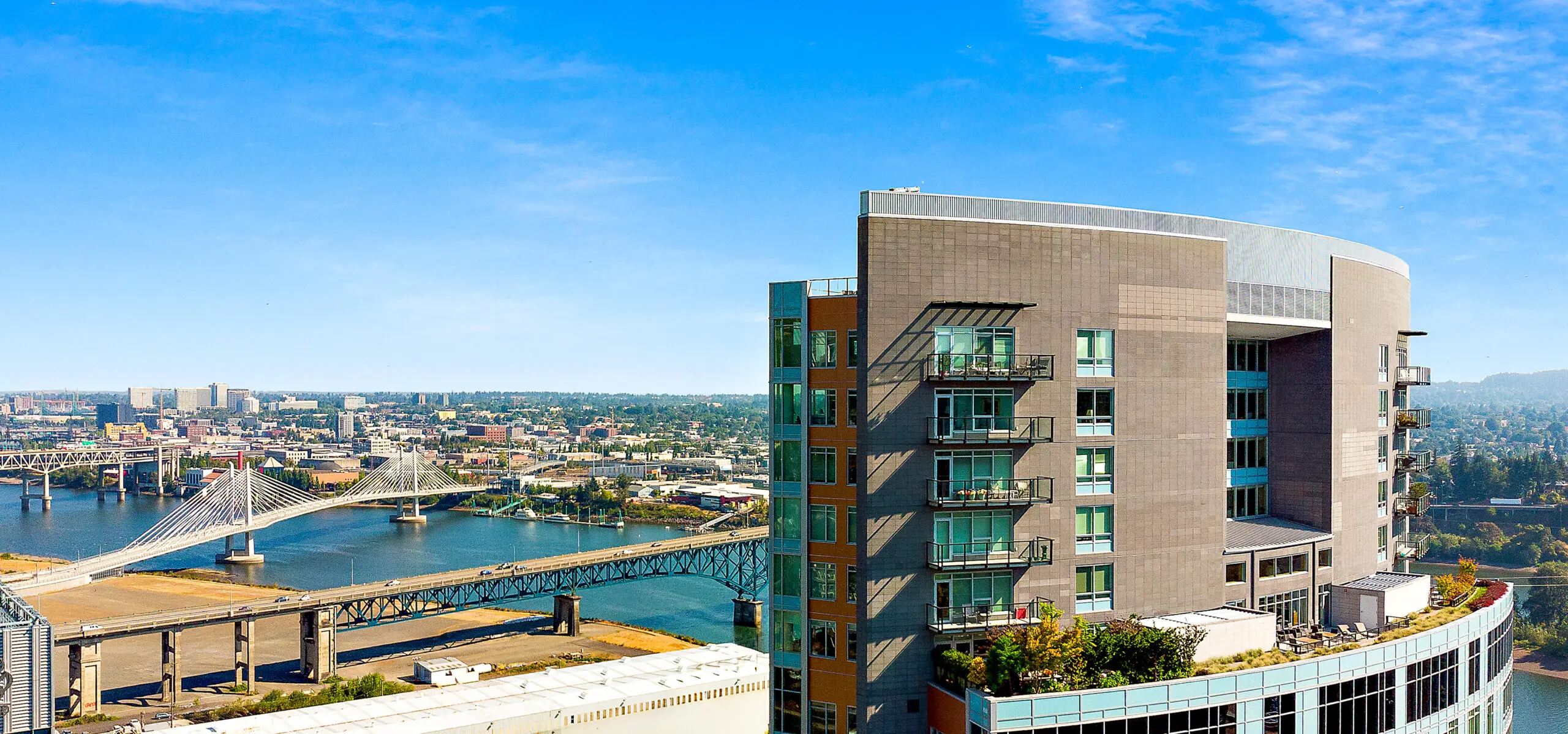 Aerial view of the Mirabella Portland building and surrounding skyline.
